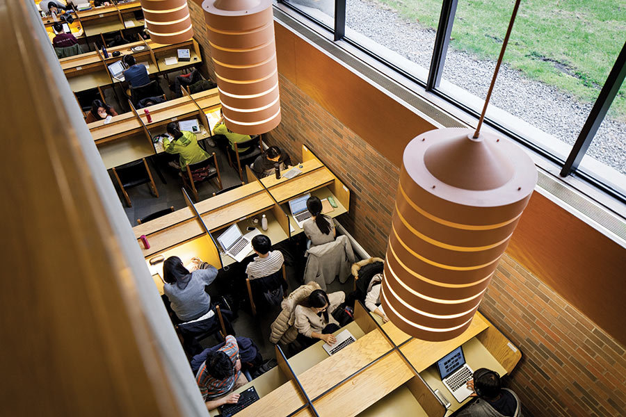 Overhead view of students studying at the cubicles located at the lower level of the Ivey Library.